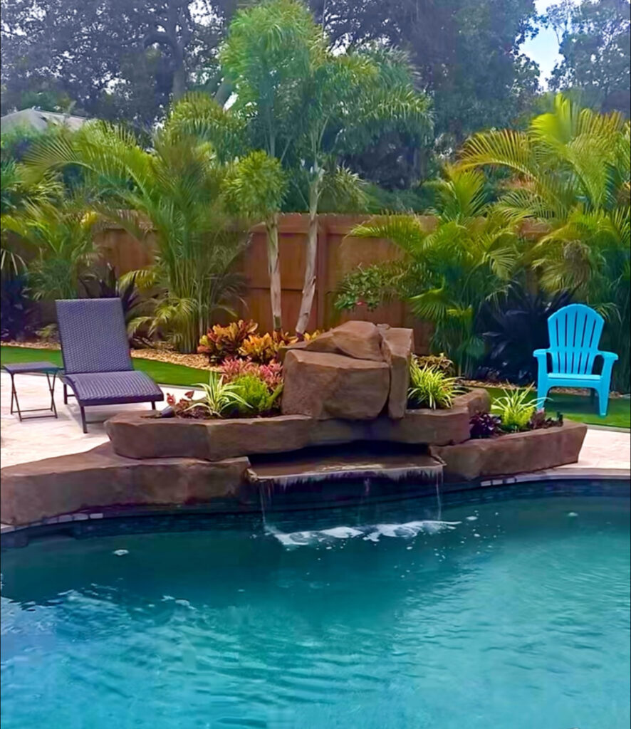 Luxury backyard waterfall feature Pinellas County pool deck